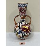 A Gien two handled globular vase with tapered neck, painted with foliage. 10¼' high. Chip to foot