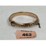 An antique gold foliate engraved hinged buckle bangle. Apparently unmarked. 20g gross