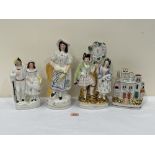 A 19th century Staffordshire figure, two groups and a cottage spill vase. The figure with basket