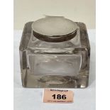 A George V glass inkwell with silver lid and mount. Engraved. Birmingham 1913. 3½' wide. Cracked