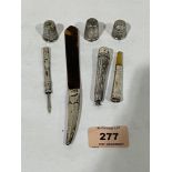 Three silver thimbles, a silver and tortoishell letter knife; a silver manicure scoop and a silver