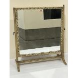 A foliate painted dressing table mirror. 20' wide. Repaired