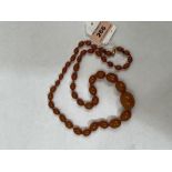 A necklace of graduated amber beads. 28½' long. 44.7g