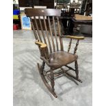 A lath-back rocking armchair