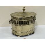 An Edward VII brass oval coal box, the domed cover with finial. 17' wide over handles