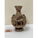 A Japanese pottery globular vase, carved with a temple in a landscape. 4½' high