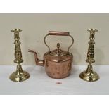 A Victorian copper kettle and a pair of 19th century brass candlesticks, 12' high (3)