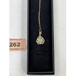 A 9ct diamond and green tourmaline pendant on 9ct necklet chain. 2.5g