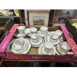 A box of cups and saucers and Trios