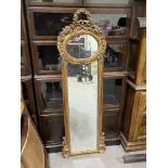 A gilt framed pier glass in French style. 57' high. Of recent manufacture