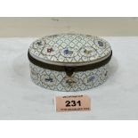 A Limoges porcelain oval box, painted with flowers in reserves on a jewelled diaper ground. 4' wide