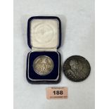 A 1922 white metal 1922 Preston Guild Memorial coin and a Ceylonese agricultural medal 1926.