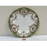 A Wedgwood trial plate painted with flower sprays and garlands by J. Hodgkiss, enriched with