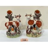 A pair of 19th century Staffordshire cow and milkmaid spill vases. 5½' high
