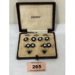 A boxed Austin Reed dress stud set