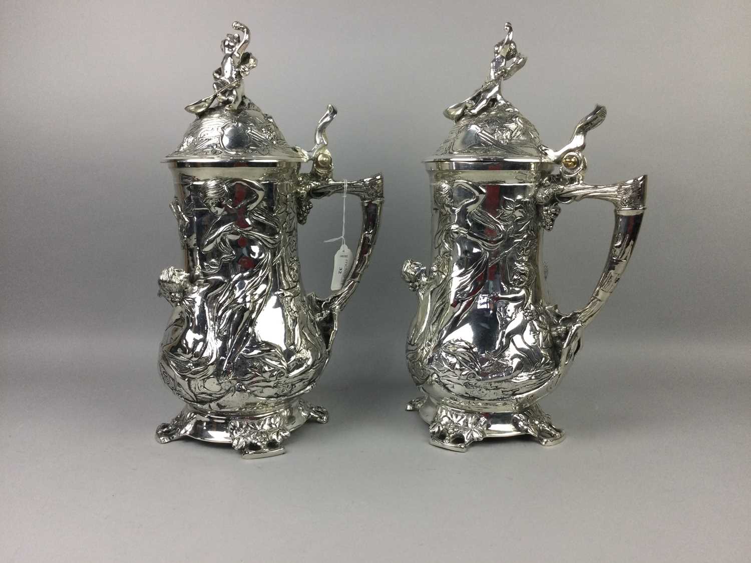 A PAIR OF CONTINENTAL SILVER PLATED TANKARDS
