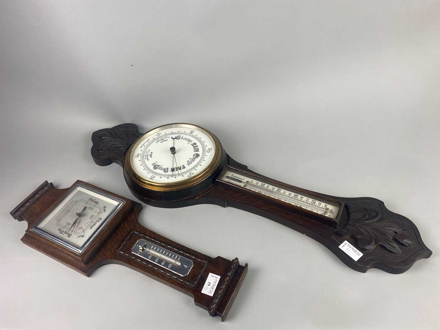 AN OAK WHEEL BAROMETER AND ANOTHER BAROMETER