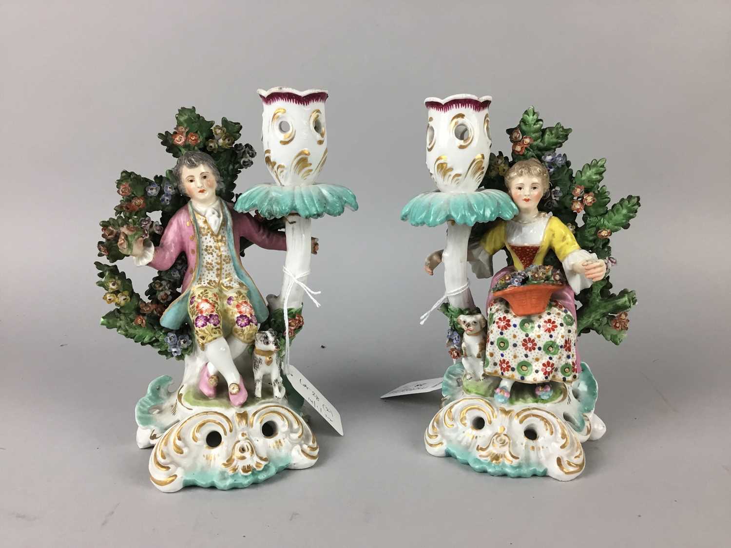 A PAIR OF SAMSON FIGURAL CANDLESTICKS