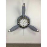 A MODERN PAINTED METAL CIRCULAR WALL CLOCK