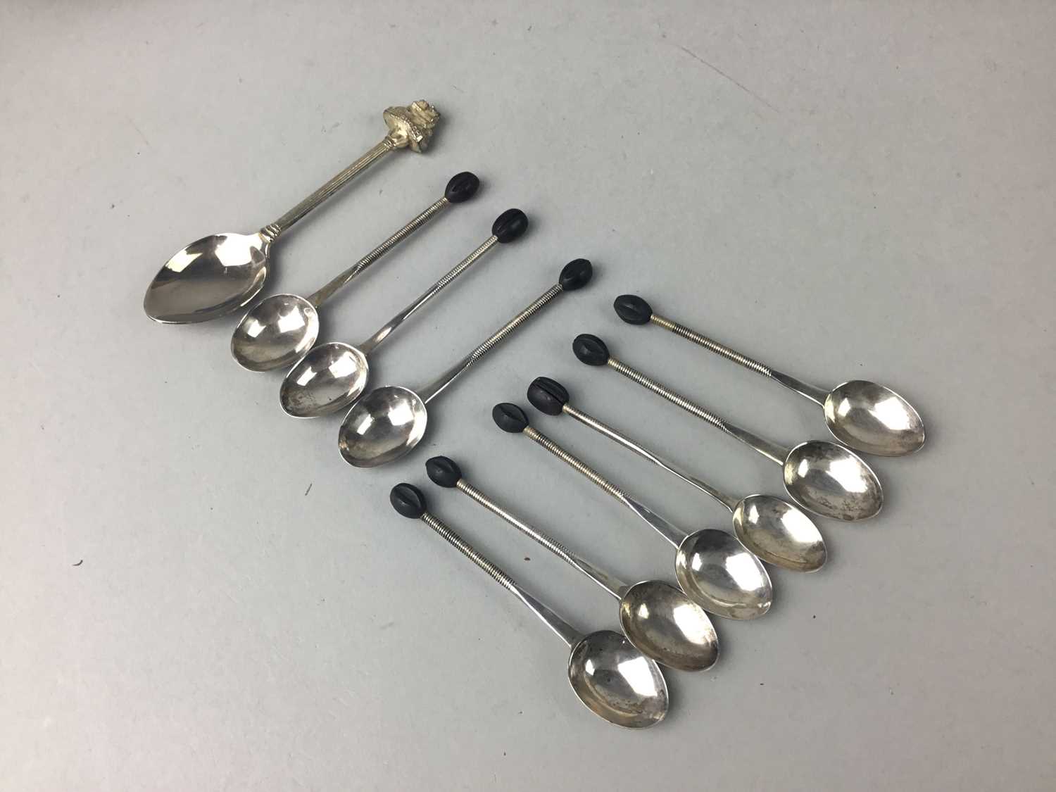 A SET OF NINE SILVER COFFEE SPOONS AND A SOUVENIR SPOON