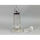 A CUT GLASS LIGHTHOUSE SUGAR CASTOR AND KNIFE RESTS