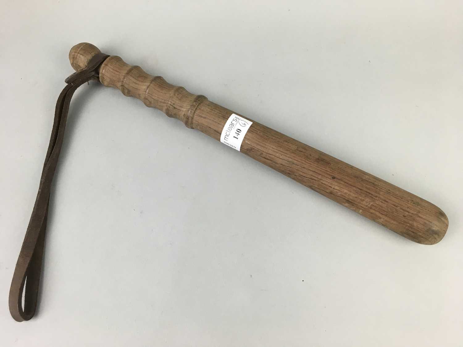 A WOODEN TRUNCHEON AND OTHERS
