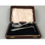 A SPOON AND PUSHER SET AND TWELVE SILVER SPOONS AND TONGS