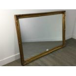 A REPRODUCTION WALL MIRROR IN GILT FRAME