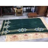 A GREEN VELVET WALL HANGING