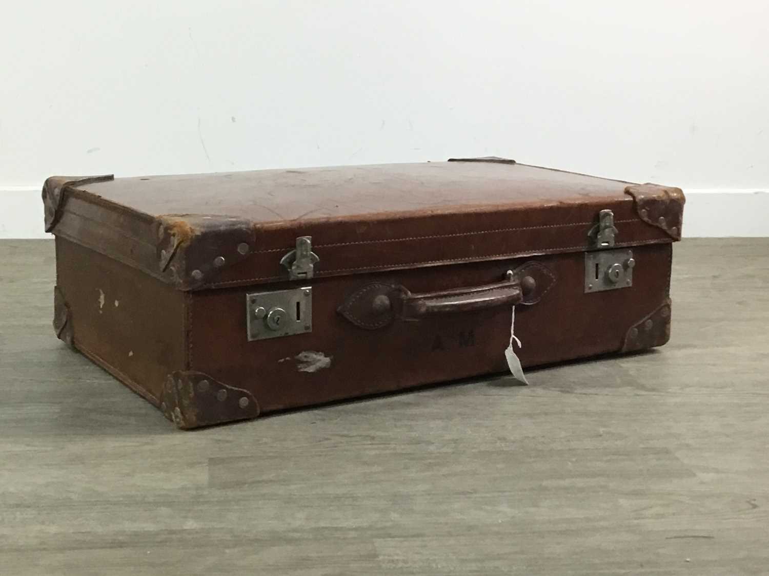 AN EARLY 20TH CENTURY LEATHER SUITCASE WITH TWO OTHERS