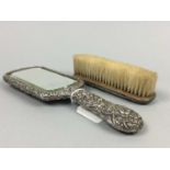 A SILVER BACKED HAND MIRROR AND BRUSH