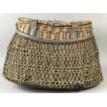 A WICKER FISHING BASKET