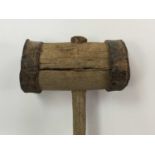 AN EARLY 20TH CENTURY FRUITWOOD AND FORGE MADE MALLET