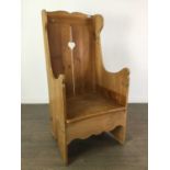 A PINE WING BACK ARMCHAIR