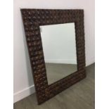 A COCONUT FRAMED WALL MIRROR