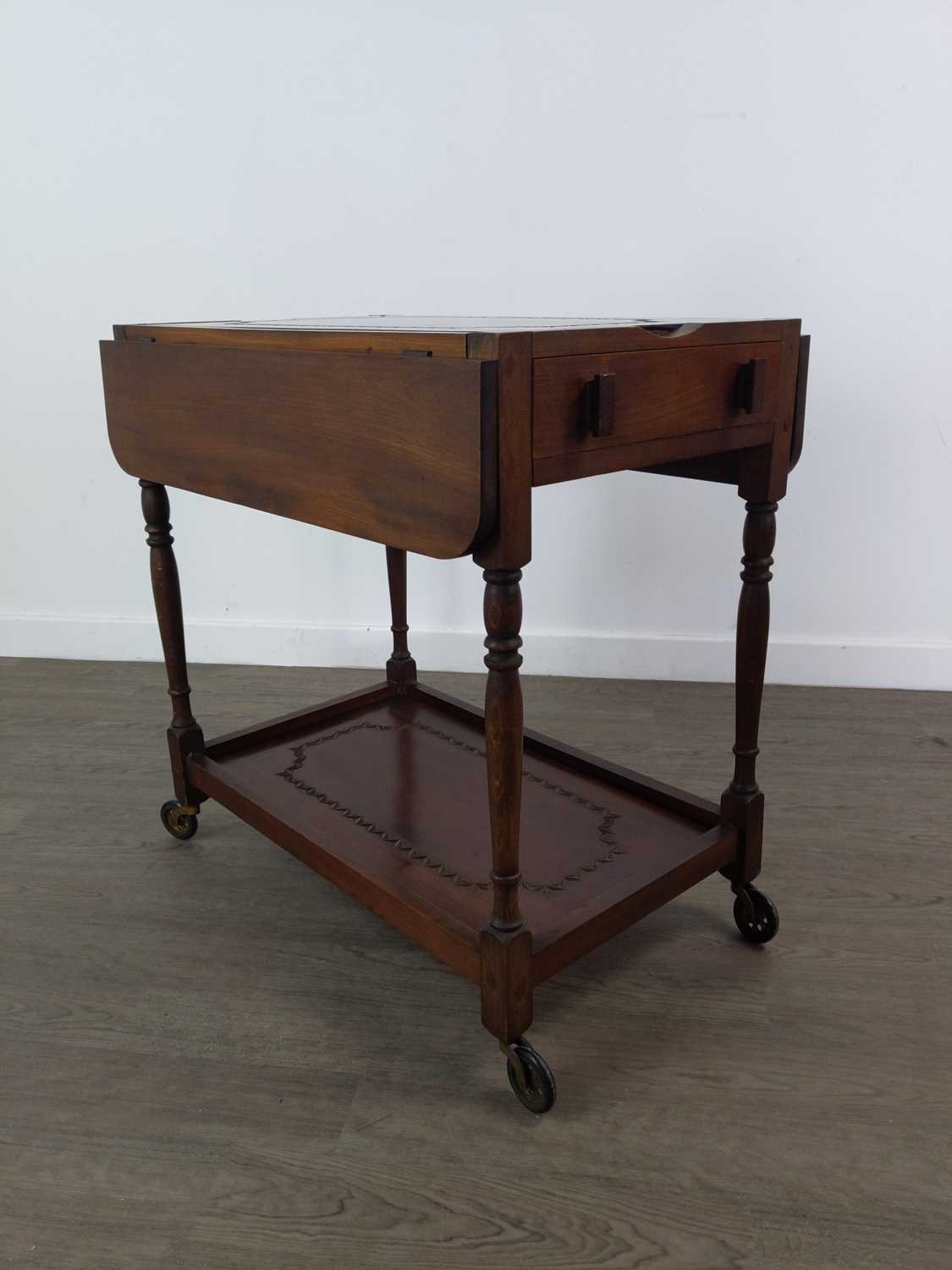 AN EARLY 20TH CENTURY WALNUT DRINKS TROLLEY