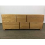 A MODERN OAK LOW CHEST OF DRAWERS
