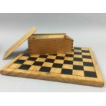 A COLLECTION OF DRAUGHTS AND CHESS PIECES AND BOARDS