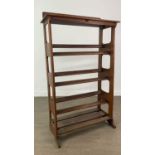 AN EARLY 20TH CENTURY OAK SHOE RACK