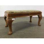 A WALNUT FOOTSTOOL, NEST OF THREE TABLES AND COFFEE TABLE