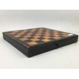 A TURNED WOOD CHESS SET WITH GAMES BOARD