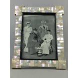 AN EARLY 20TH CENTURY MOTHER OF PEARL PHOTOGRAPH FRAME