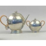 A NICK MUNRO PEWTER THREE PIECE TEA SERVICE AND FOUR OTHER DISHES