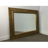 A LARGE GILT WALL MIRROR