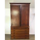 A VICTORIAN MAHOGANY LINEN CUPBOARD ON CHEST