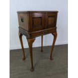 AN EARLY 20TH CENTURY OAK TABLE CANTEEN