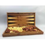 A BURR WALNUT VENEERED GAMES BOARD