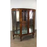 A WALNUT BOW FRONT DISPLAY CABINET