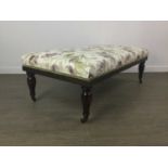 AN UPHOLSTERED OTTOMAN