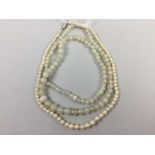 A PEARL SINGLE STRAND GRADUATED NECKLACE AND A JADEITE BEAD NECKLACE